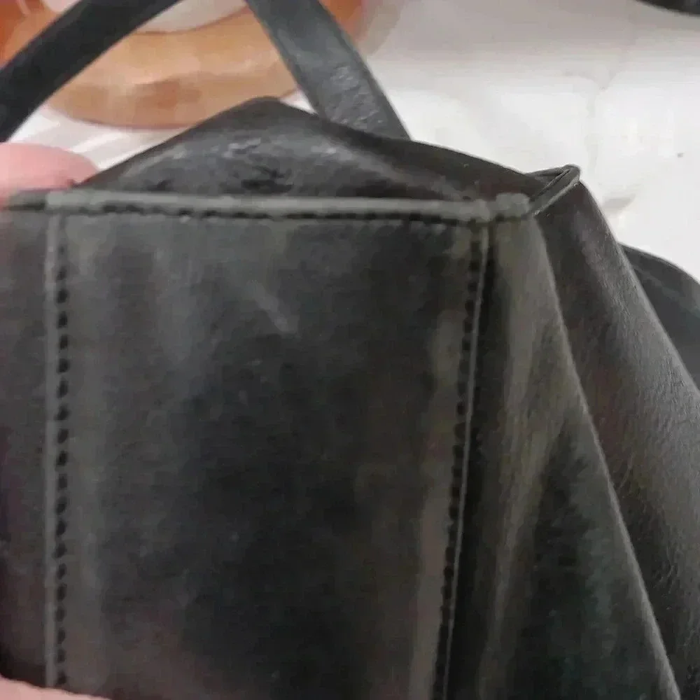Rolf's Black leather shoulder bag with pockets